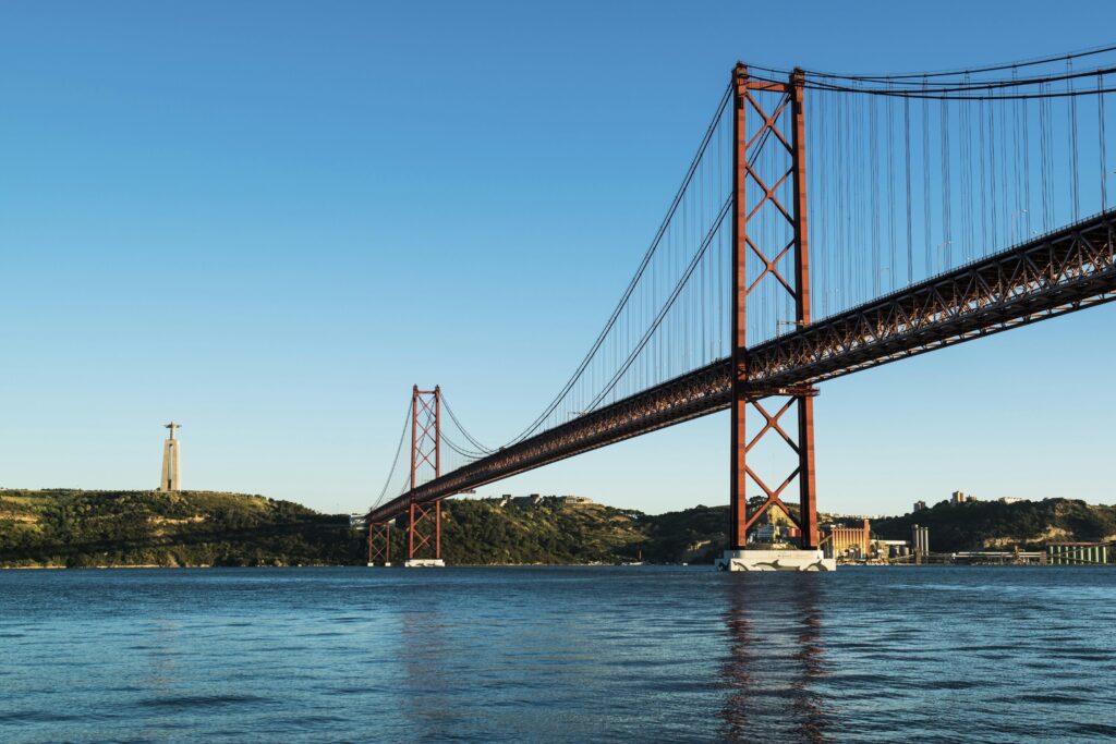 Explore the stunning architecture of the 25 de Abril Bridge spanning the Tagus River in Lisbon, Portugal.