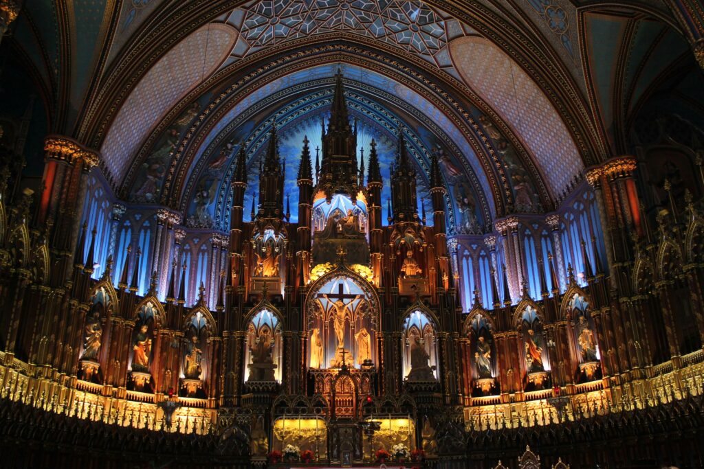 Detailed view of the ornate altar in Notre Dame Basilica, showcasing Gothic architecture indoors.