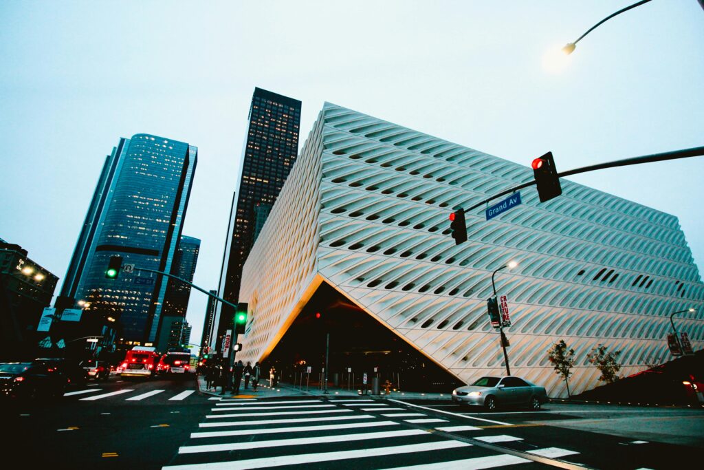 Explore Los Angeles architecture with futuristic buildings and city traffic captured at dusk.
