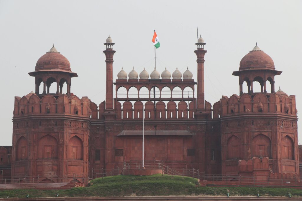 A stunning view of the iconic Red Fort with the Indian flag flying high, in New Delhi.