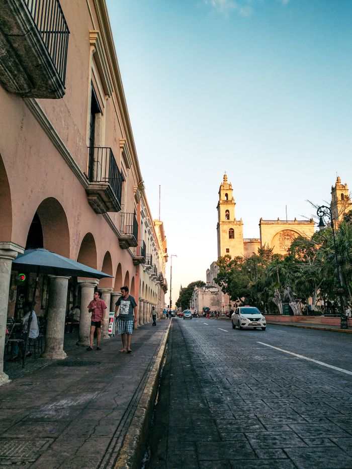 Capture of Mérida's traditional architecture and streets, showcasing the historic cathedral in the evening light.