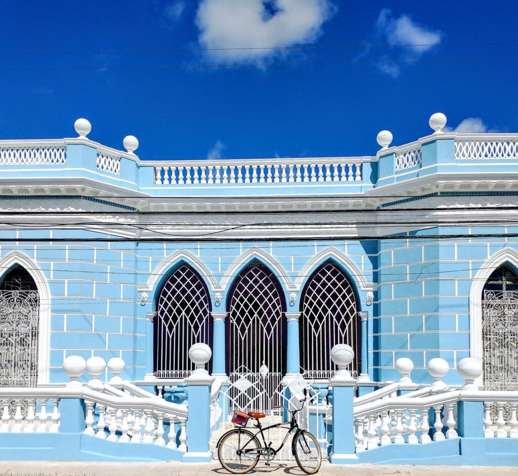 Spanish colonial architecture with arabesque patterns and azure sky in Merida, Mexico.